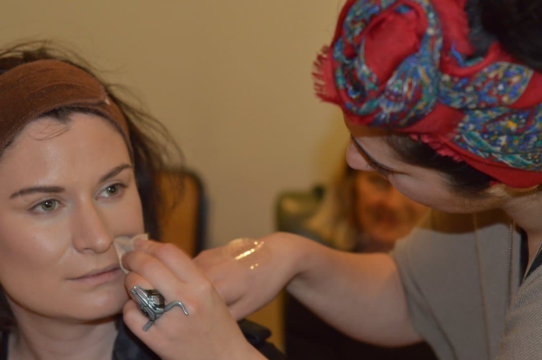 Vasii applying makeup for a client